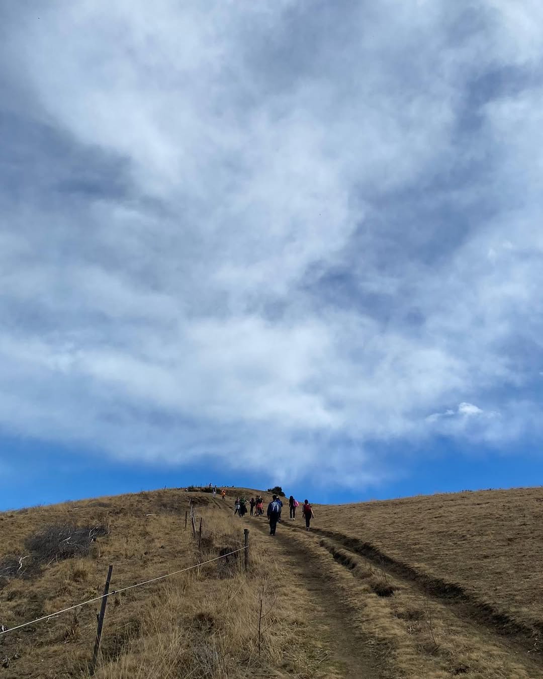 Instagram post of a hiker on a mountain peak
